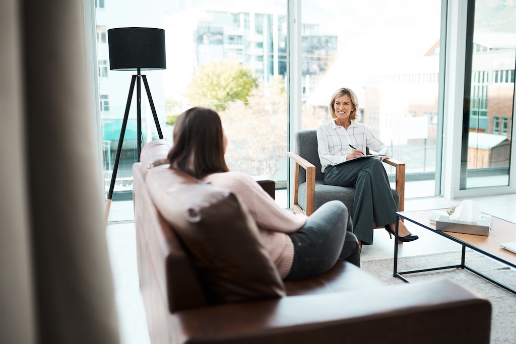 Shot of a psychologist having a therapeutic session with her patient.