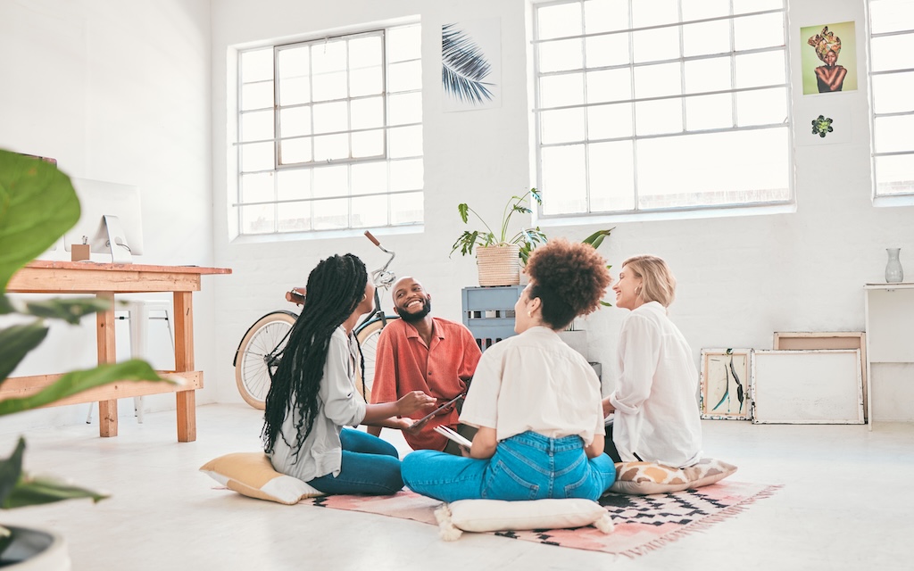 Happy, carefree and relaxed group engaged therapy session, talking and bonding