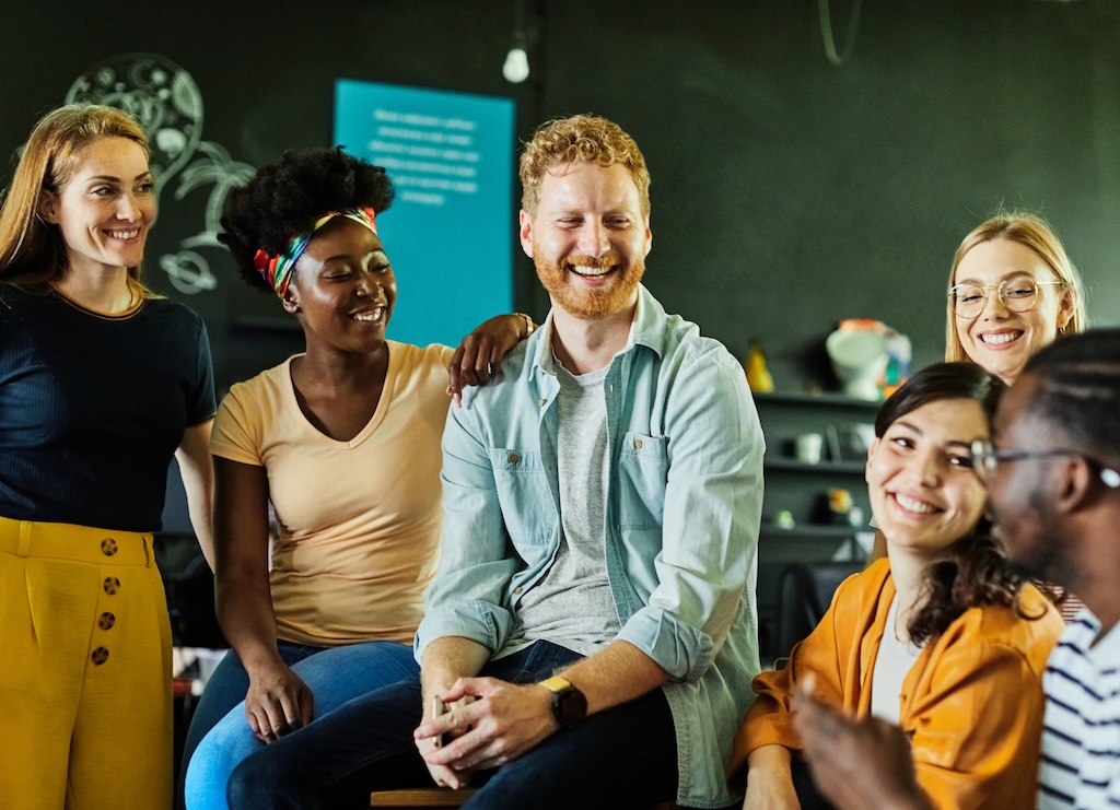 Group of young people having a group therapy session in addiction recovery