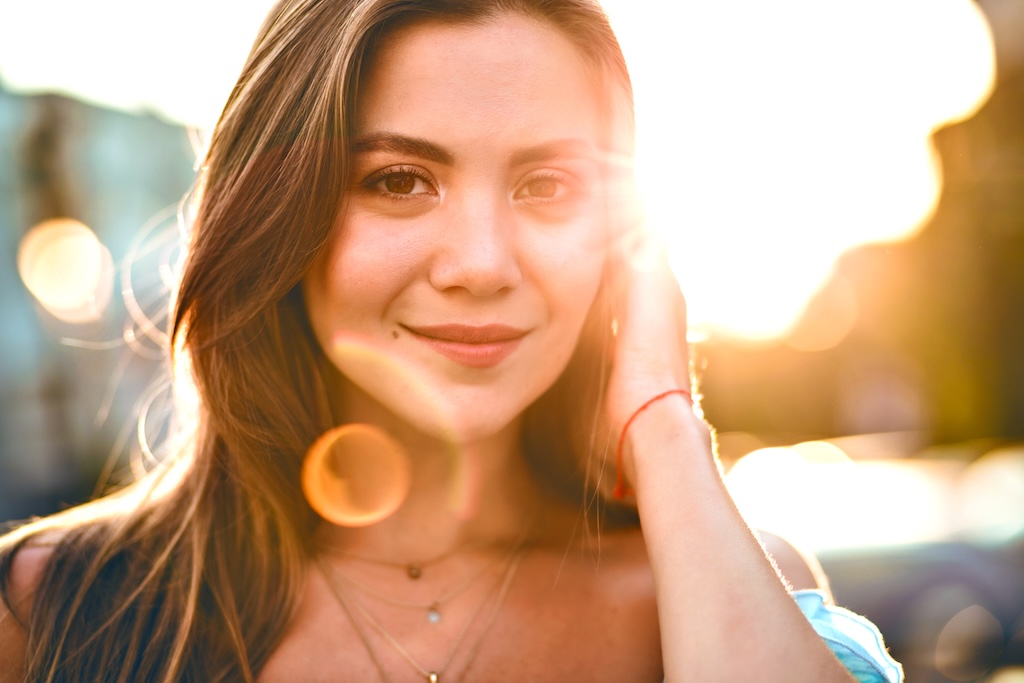 Woman smiling into the camera, healing concept
