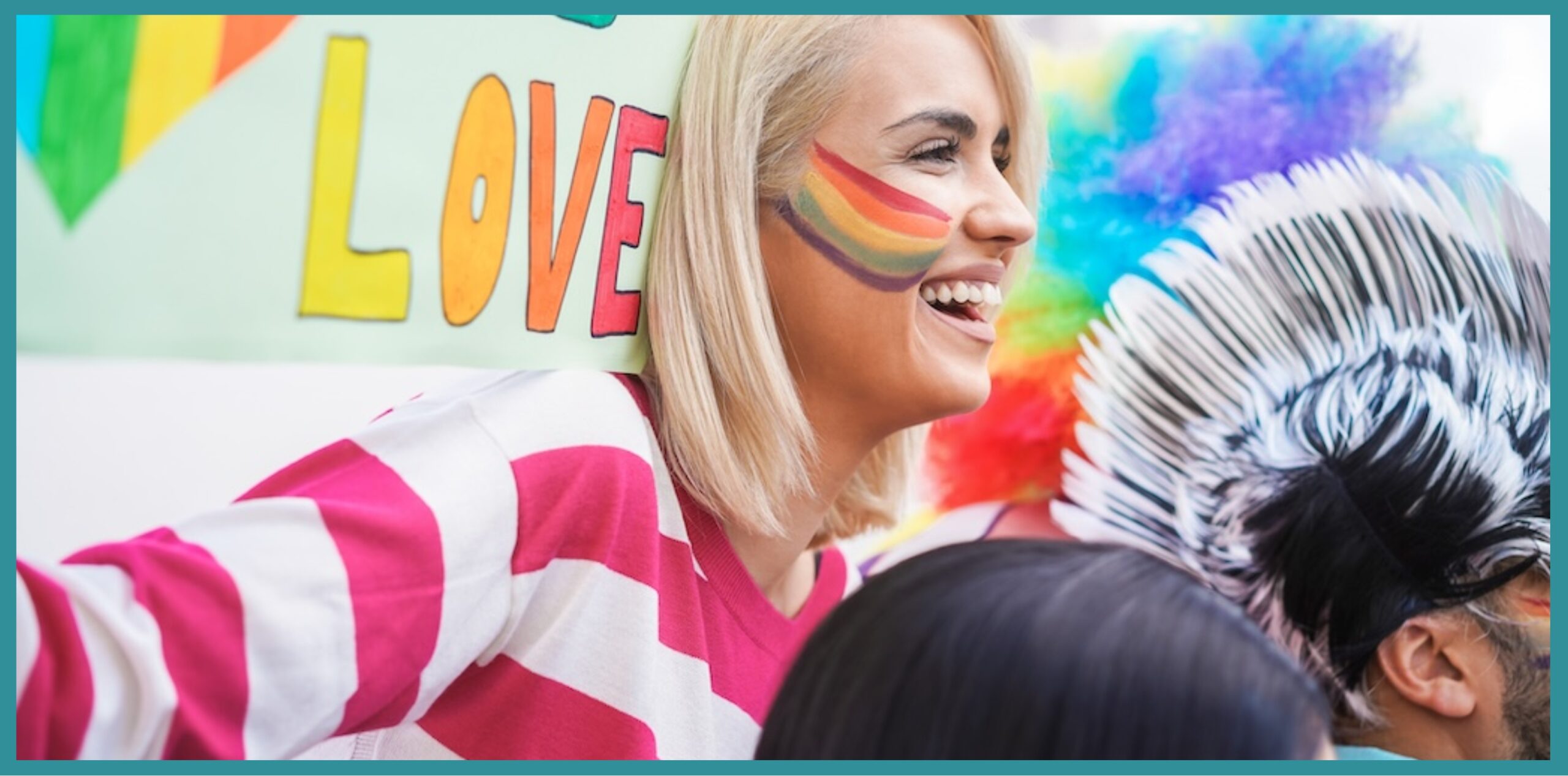 LGBTQ Woman with rainbow painted face at festival