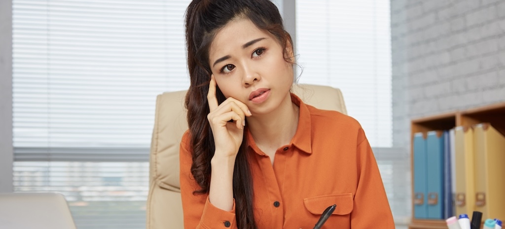 Pensive professional at her desk