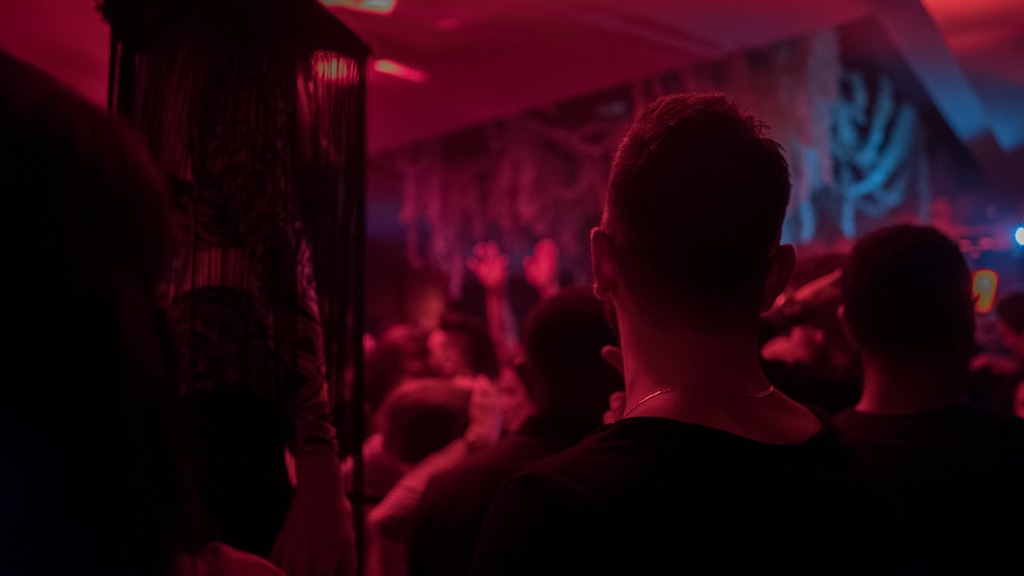 Indistinguishable of individuals at a club, minimal lighting