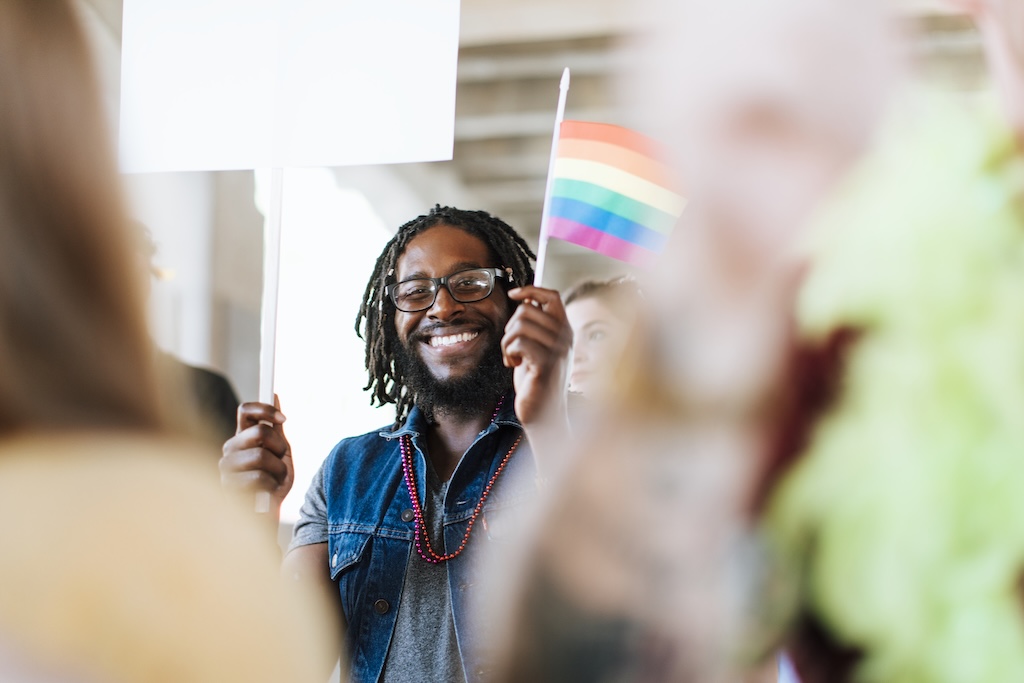Young man at professional conference during LGBTQ pride month