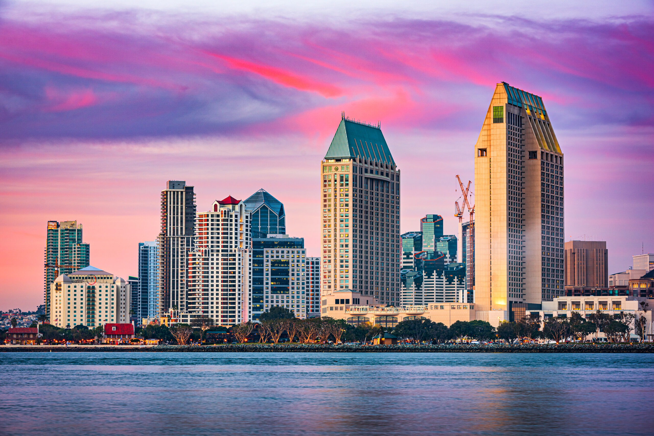 San Diego, California, USA downtown skyline on the San Diego Bay at dusk.
