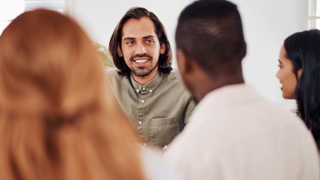 Man in group therapy session for healing