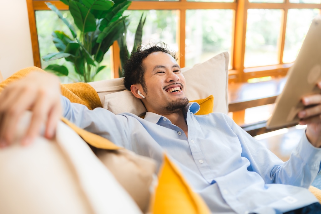 Smart positive smile male in online therapy group