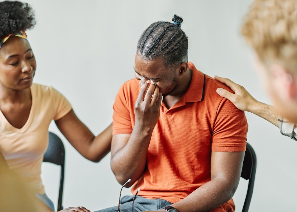 Group psychotherapy. Persons sitting in circle and talking. People meeting. Psychotherapy training, business lecture or conference. Man woman support group