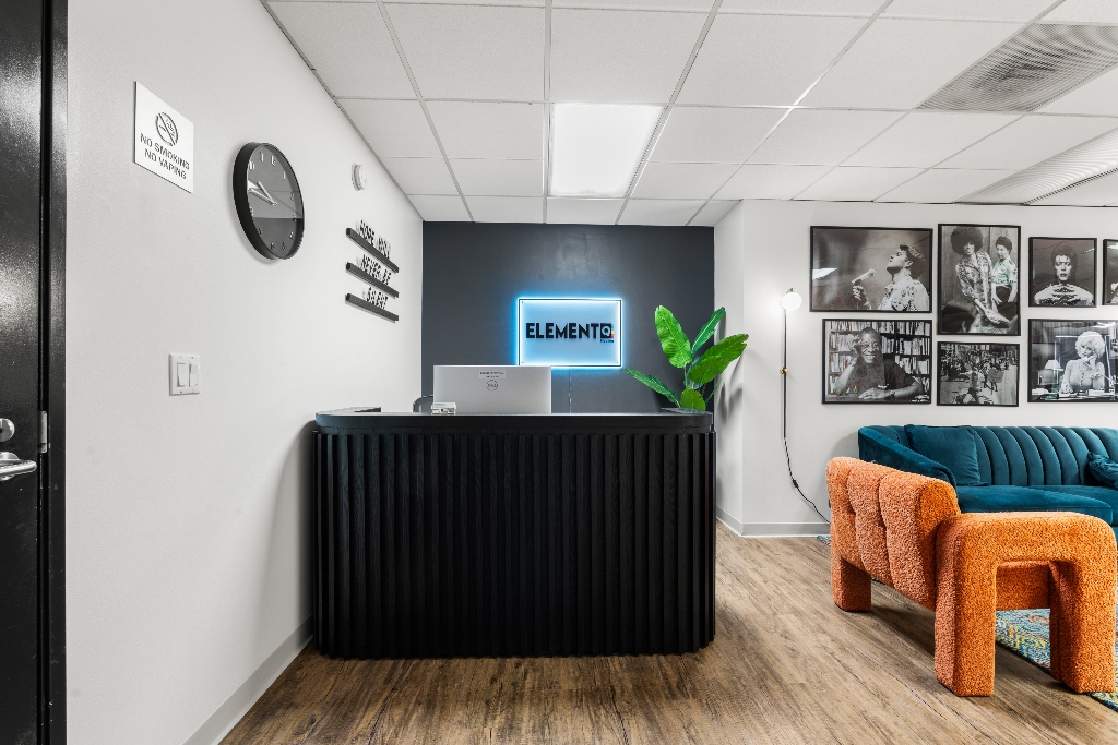 Element Q Healing front desk in San Diego, featuring a modern reception area with welcoming seating, LGBTQ+-affirming environment, and intake space for outpatient mental health and substance use treatment (IOP/PHP)