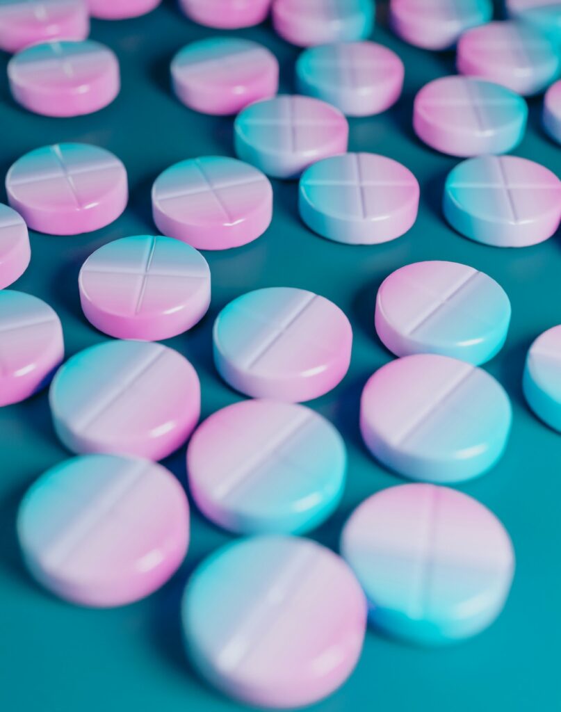 Abstract close-up of colorful tablets, representing substance use in the context of chemsex addiction treatment in San Diego