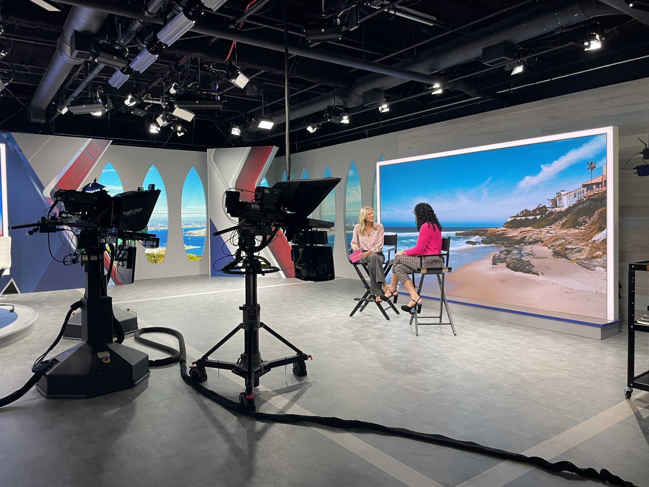 Element Q Healing Center co-founder interviewed in a San Diego television studio for a segment on LGBTQIA+ mental health.