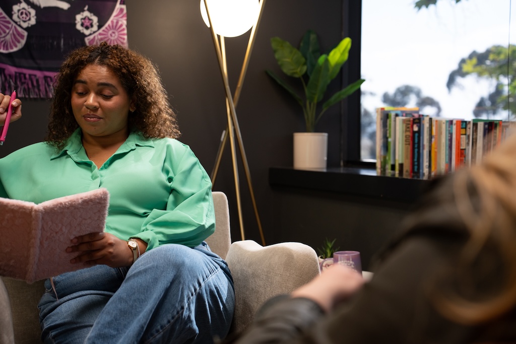Therapist meeting one-on-one with a client at Element Q Healing Center, reflecting LGBTQIA+ affirming and trauma-informed mental health care.