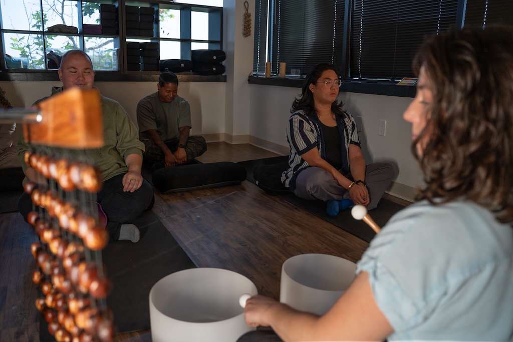 Clients participating in a guided sound healing and mindfulness group at Element Q Healing Center.