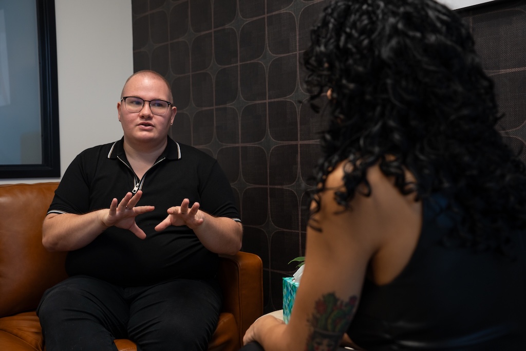Client sharing their experiences during an individual therapy session at Element Q Healing Center.